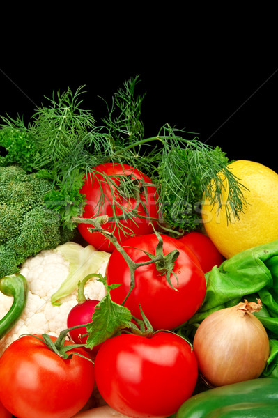 Group of different vegetables on black vertically Stock photo © dla4
