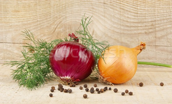 Onion,red onion,dill,pepper and allspice on wooden plank Stock photo © dla4