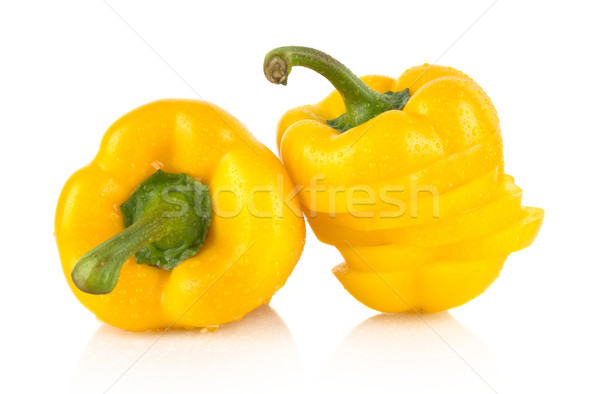 Closeup slices of yellow bell peppers on white with drops of water Stock photo © dla4