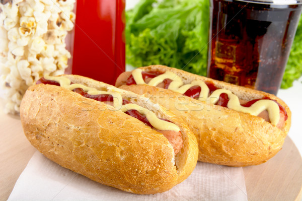 Hotdog with bottle of mustard and ketchup with drink cola,popcor Stock photo © dla4