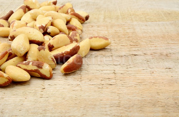 Brasil nuts in the corner on wooden plank Stock photo © dla4