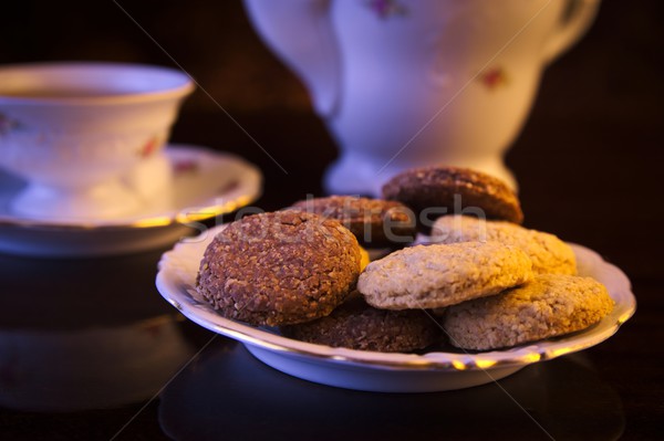 Old-style kettle with cup of tea on black Stock photo © dla4