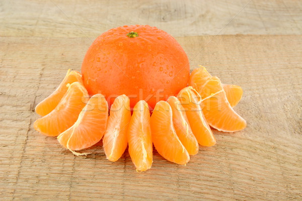 Studio shot pieces dewy mandarines on wooden table Stock photo © dla4