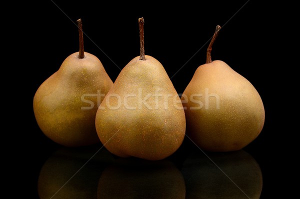 Three pears called manon isolated on black Stock photo © dla4