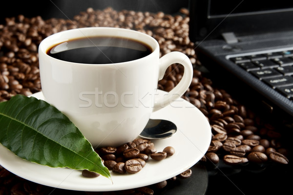 Cup of coffee with mist,laptop,coffee leaf at breakfast Stock photo © dla4