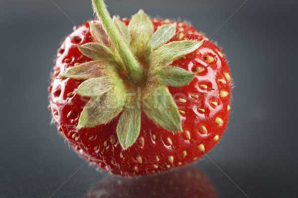 Front view of whole strawberry on natural dark background Stock photo © dla4