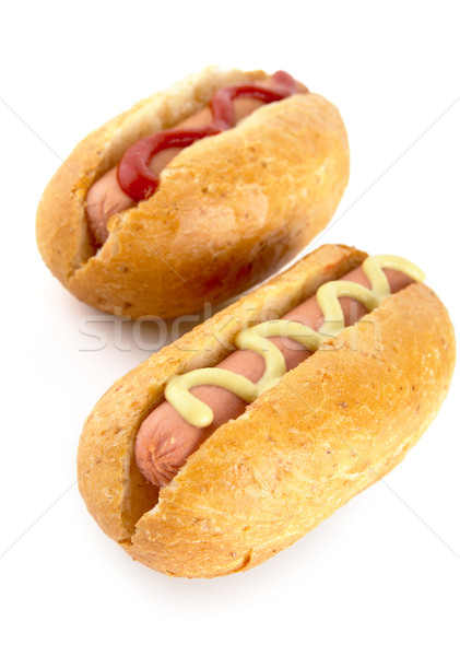 Hotdogs with mustard and ketchup isolated on white from above Stock photo © dla4