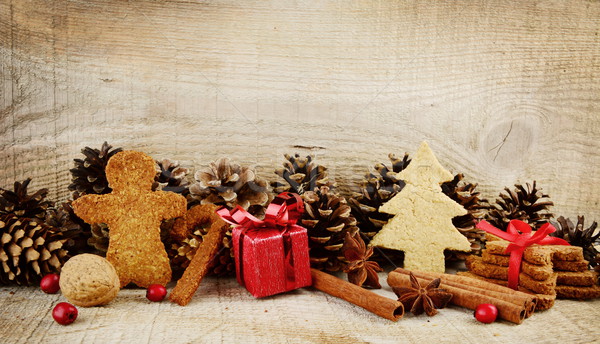 Christmas atmosphere scenery with santa claus,red gift on wooden Stock photo © dla4