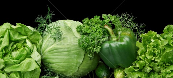 Set of green vege-cabbage,lettuce,bell pepper,dill on black at the bottom Stock photo © dla4