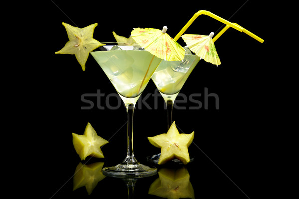 Cosmopolitan margarita drinks with carambola fruit on black Stock photo © dla4
