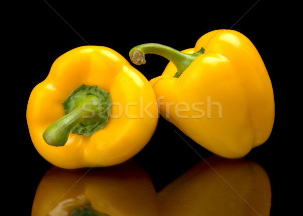 Studio shot of yellow bell peppers isolated on black Stock photo © dla4
