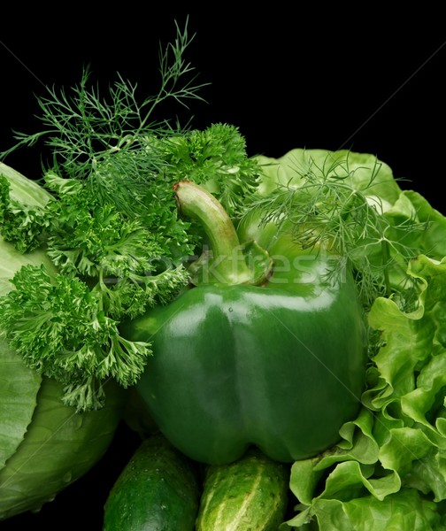 Set of green vegetables-lettuce,bell pepper,dill on black at the bottom Stock photo © dla4