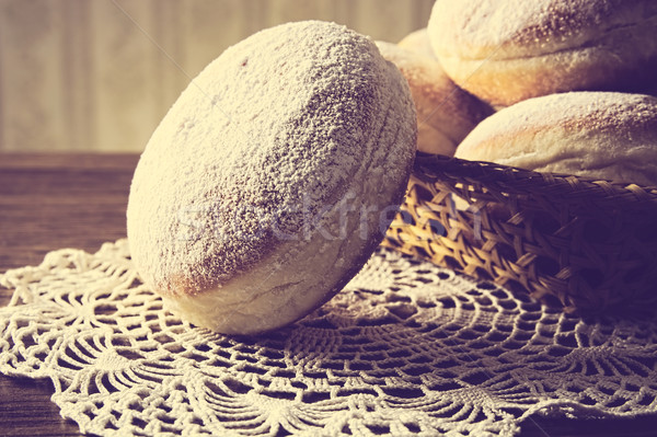 Stock photo: Closeup shot of doughnuts in wicker basket vintage effect 