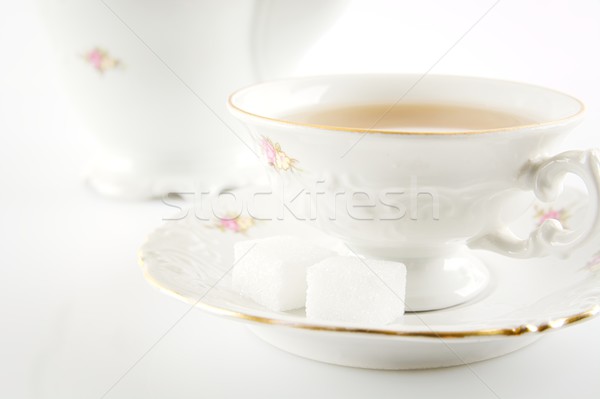 Studio shot cut image in old-style jug with tea on white backgro Stock photo © dla4