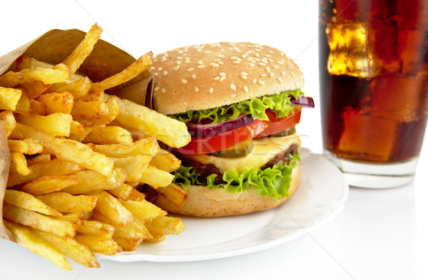 Closeup shot of cheeseburger,french fries,glass of cola on plate Stock photo © dla4
