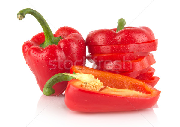 Closeup halved red bell peppers with drops of water on white Stock photo © dla4