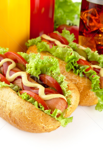 Hotdogs with lettuce,tomatoes and cucumber on white background Stock photo © dla4