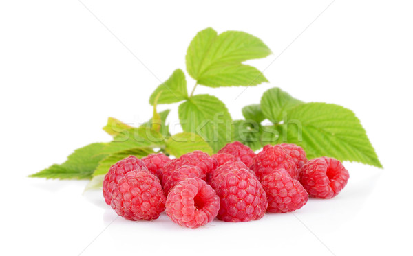 Few raspberries with leaves isolated on white Stock photo © dla4