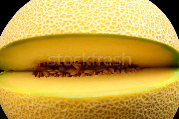 Close-up shot of melon galia notched isolated black Stock photo © dla4