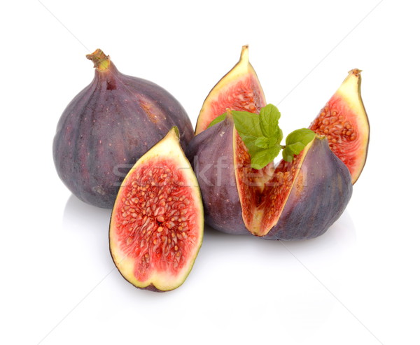 Three figs with mint,split like flower isolated on white backgro Stock photo © dla4