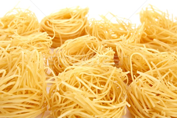 Closeup shot of many tagliatelle on white Stock photo © dla4