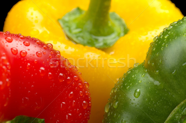 Cut shot green,red,yellow bell pepper background with water drop Stock photo © dla4