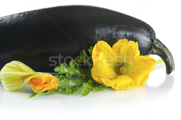 Black courgette with flowers on white with leaf Stock photo © dla4