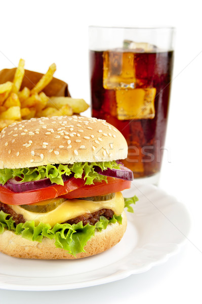 Cropped image of cheeseburger,french fries,glass of cola on plat Stock photo © dla4