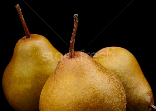 Three pears called manon isolated on black Stock photo © dla4