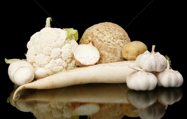 Collection of white vegetables on black with reflection Stock photo © dla4