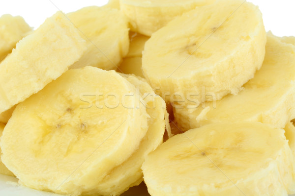 Macro shot of slices of banana on white background  Stock photo © dla4