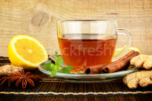 Stock photo: Ginger tea-ingwertee on brown mat with lemon