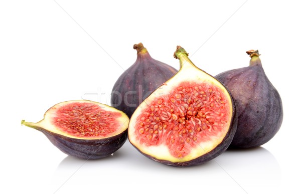 Four sliced figs isolated on white background Stock photo © dla4