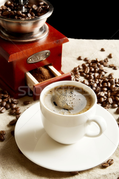 Cup of coffee with bag,coffee beans on flax linen Stock photo © dla4