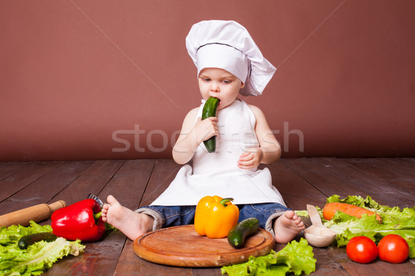 little boy Cook carrots, peppers, tomatoes, lettuce, Stock photo © dmitriisimakov