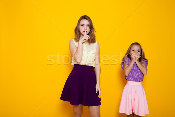 Stock photo: two girls shut mouth silence