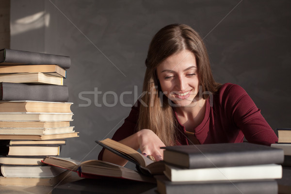 girl reads a lot of books at home Stock photo © dmitriisimakov