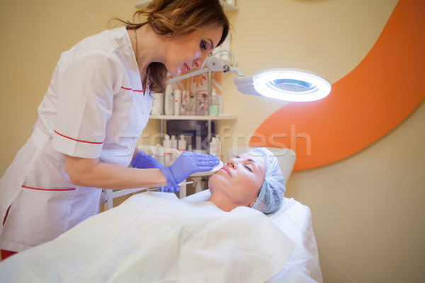 doctor cosmetologist makes injection syringe on the face Stock photo © dmitriisimakov