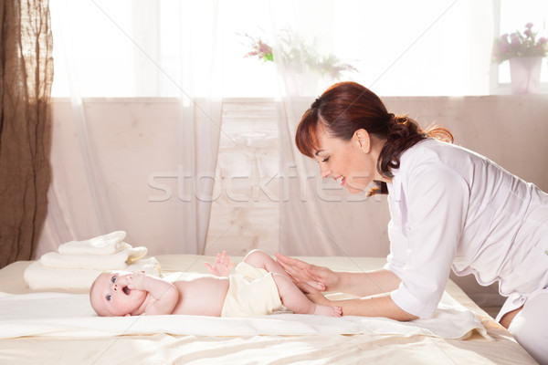 the little boy baby doctor doing massage Stock photo © dmitriisimakov