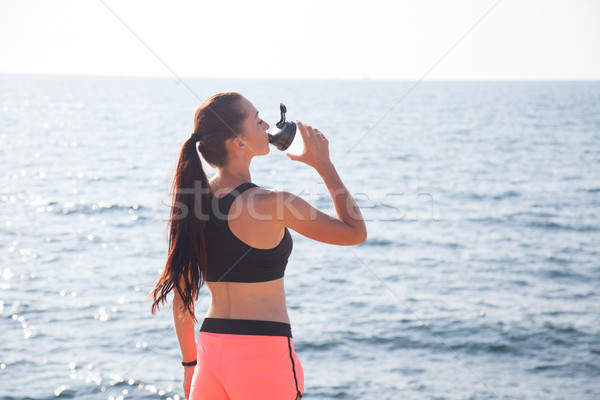 Fitness girl drinks water sport training Stock photo © dmitriisimakov