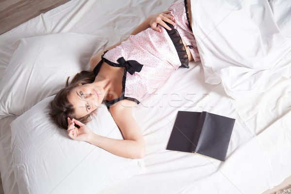 Lány pizsama ágy könyv gyermek fény Stock fotó © dmitriisimakov