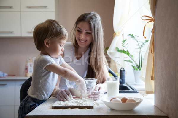 mother and young son prepare a cake in the kitchen Stock photo © dmitriisimakov