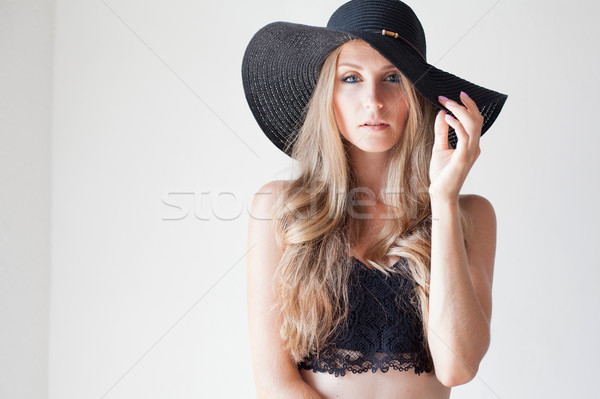 fashionable girl in a hat with a brim poses for advertising Stock photo © dmitriisimakov