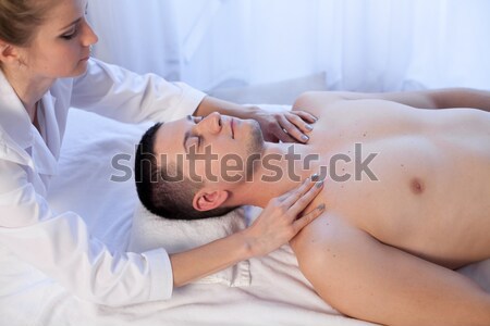 masseuse makes a therapeutic massage of the head and neck man Spa 1 Stock photo © dmitriisimakov