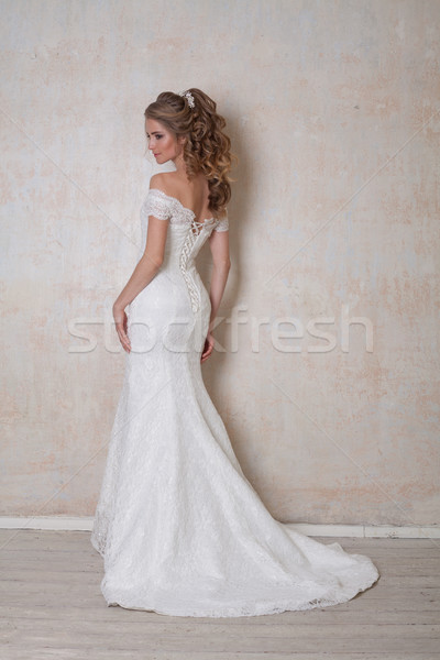 Gyönyörű menyasszony pózol esküvő hajviselet ruha Stock fotó © dmitriisimakov