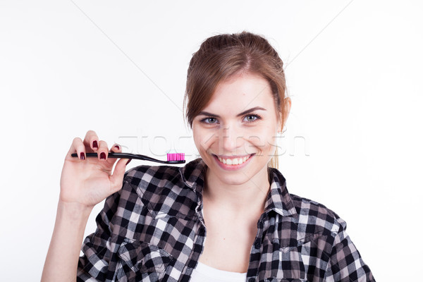 the girl in the bathtub with a toothbrush teeth smile Stock photo © dmitriisimakov