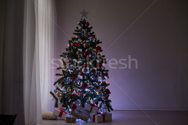 garlands of lights on a Christmas tree for Christmas Decor Stock photo © dmitriisimakov