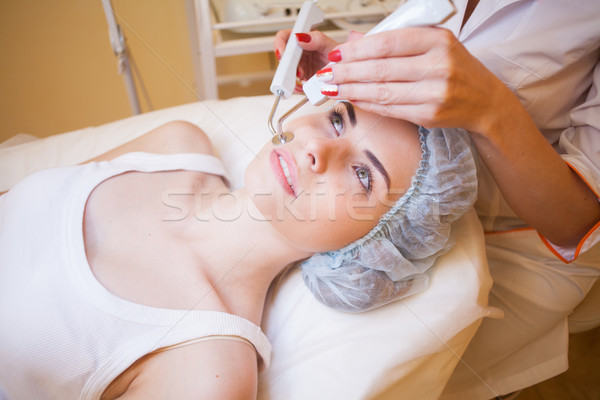 Cosmetology doctor makes facial procedures Stock photo © dmitriisimakov