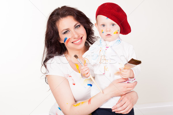 mother and little boy paints when painted Stock photo © dmitriisimakov