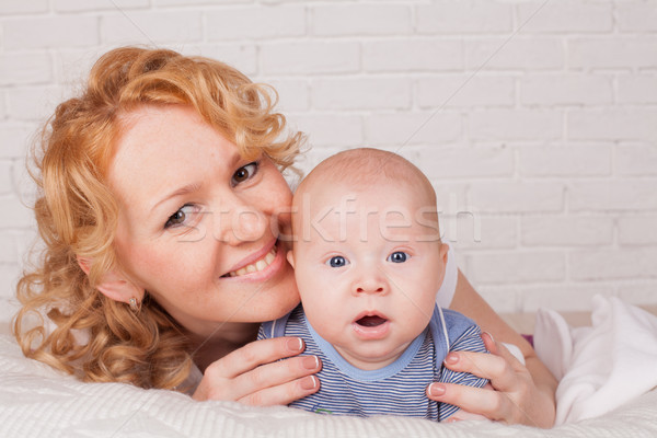 redhead mom's and baby's portrait Stock photo © dmitriisimakov
